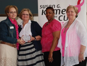 Komen St. Louis Board President Dede Hoffmann presents our 2013 Community Partner of the Year Award to Siteman's Breast Cancer for At-Risk Communities program team
