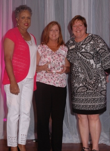 Theresa Taylor (center) with Komen St. Louis Board Member Lillie Thomas and Executive Director Helen Chesnut